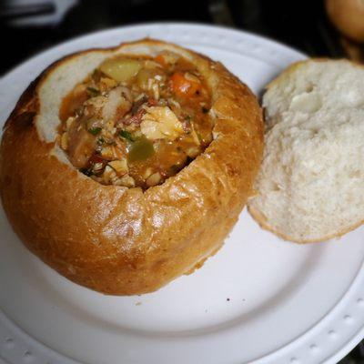 Manhattan  clam chowder  in a fresh  bread bowl to go. So freaking delicious. Simply  the best.