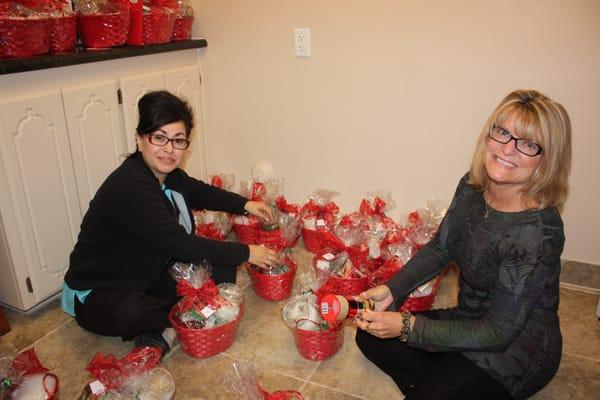 Roxanne and Maria, putting together 'thank-you' Christmas baskets for some extraordinary patients!