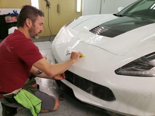 Laying the new 'self-healing' clearbra on this slow car. Heat actually completely removes scratches from the film