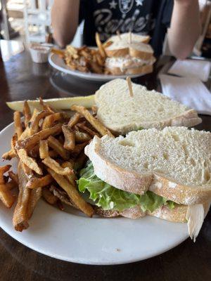 Turkey Sandwich on sour dough with fries.