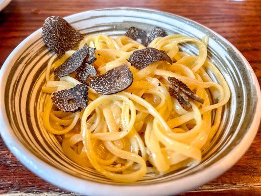 Homemade pasta with oil, garlic, locatelli, and shaved black truffles. Omg amazing!!!