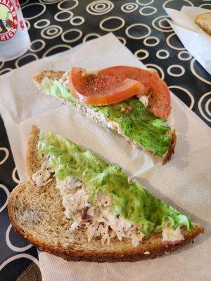 Chicken salad sandwich with lots of empty bread