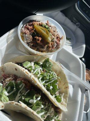 Elote topped with Brisket and Brisket Mexican Tacos