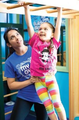 Doing the monkey bars, working on strong arms and agility