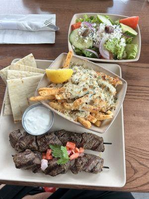 Souvlaki Plate.  Steak skewer and chopped salad and upgraded to Feta Fries!