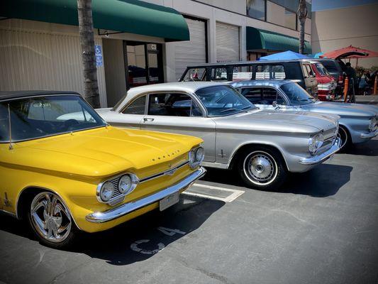 Corvairs in parking lot