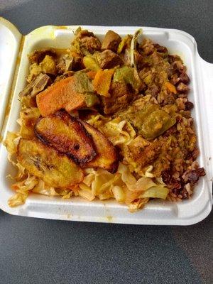 Small goat curry with cabbage, plantains, and rice and peas ($11.50). PLENTY of food for me but you can get large for a little more.