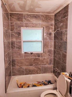 Bathroom window replacement and tiling after