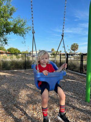 Grandma and Grandpa!  Are you seriously putting me in this baby swing??? February 2024,  Hudson with a lil boo-boo on his forehead.