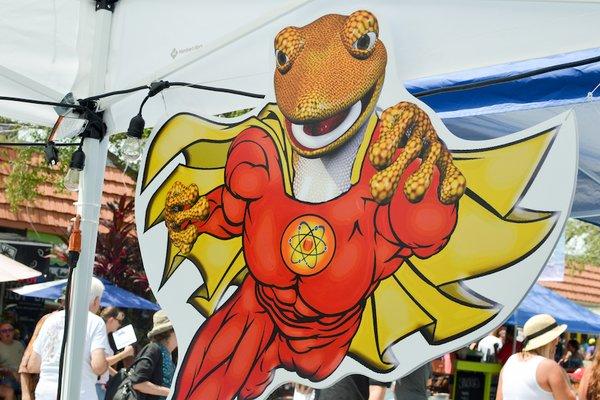 Photo by Angeline Bruno.  Image of cardboard cutout of gecko wearing costume.