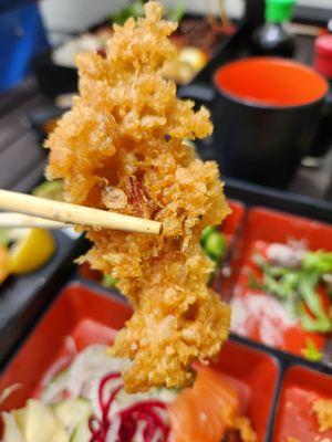 More than 2/3 length of the shrimp tempura was batter