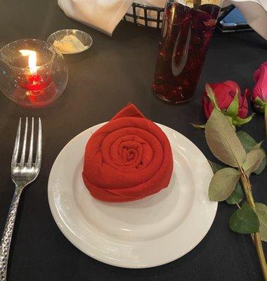 Rose on the place !! was  a red cloth napkin  made into a Rose shape !! Nice touch !! Loved it all