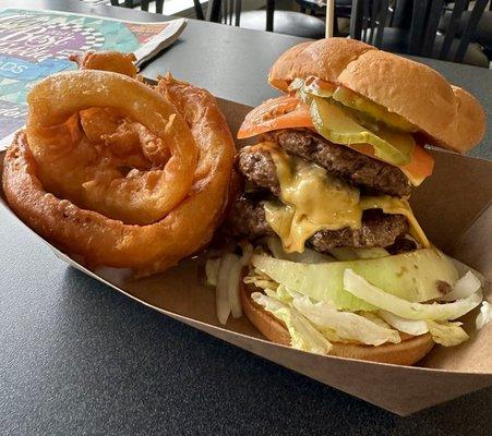 The Triple Triple Burger normally comes with the (3) onion rings on the burger itself.