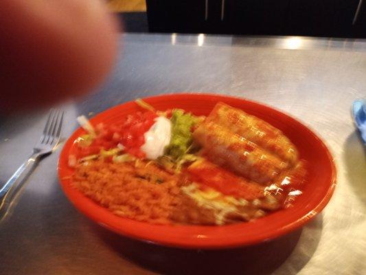 Blurry chimichanga plate and thumb.  Sorry, was good.