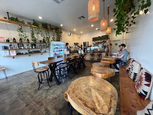 The indoor area has a nice communal table and individual tables.