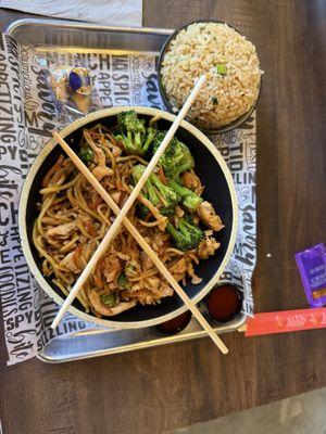 Fried rice, chicken, garlic butter noodles, broccoli, and carrots