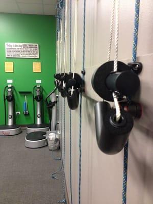 Cervical neck traction units line the wall.