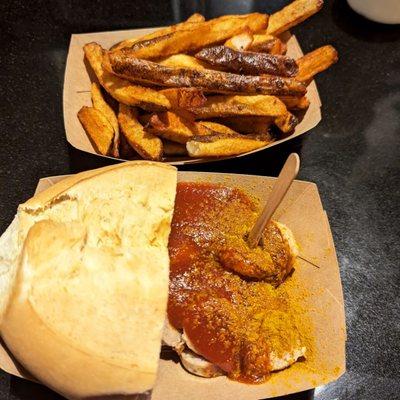 Currywurst with bread and fries.