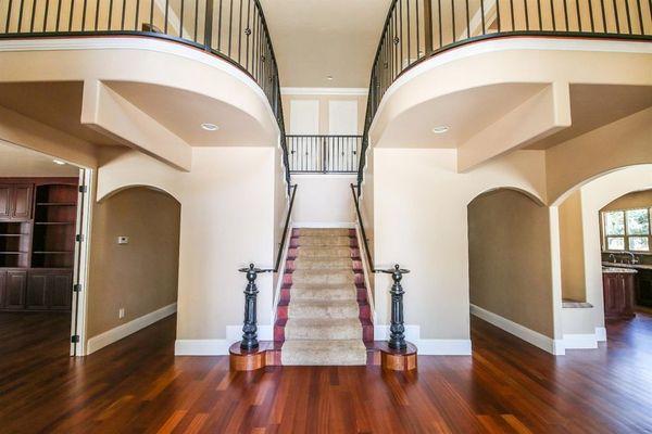 Dramatic entrance to home. Brazilian Cherry harwood floors throughout first floor of home.