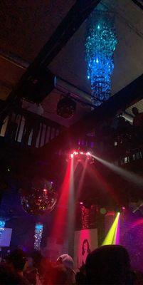 View of the disco ball and the upstairs that overhangs the dance floor.