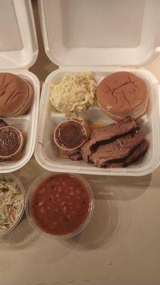 Beef brisket plate with potato salad and baked beans