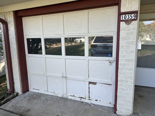 Old Damaged Single car garage door transformation (SAVE BIG THIS SEASON UP TO $499 OFF New GARAGE DOORS ) picture BEFORE