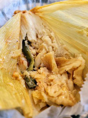 Veggie tamale. Had the chicken and pork tamale in the car but didn't capture a photo. All were delicious.  Soft and tasty masa and fillings!