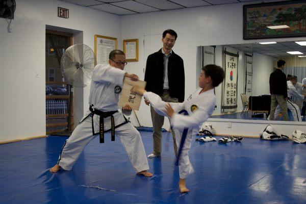 Board breaking on the kids belt promotion test.