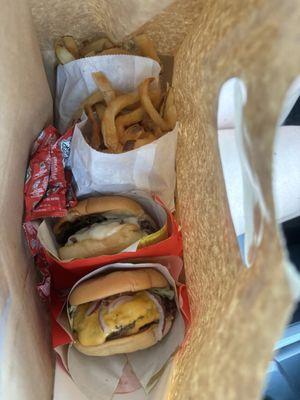 Atomic burger and mushroom Swiss burger with fries