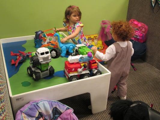 Kids play while parents shop