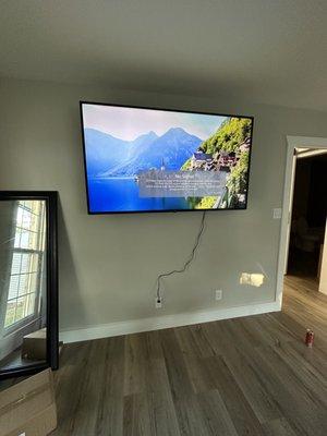 65 inch tv mounted on full motion mounting bracket. No wires hidden.