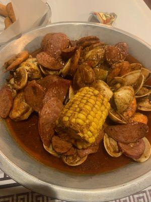 Make your own combo, with sausage, clams and headless shrimp. Combo seasoning and hot spice level.