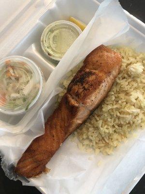 Grilled salmon with rice, dill sauce and coleslaw