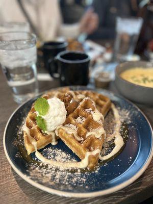 Sweet potato waffles and savory grits with coffee and water