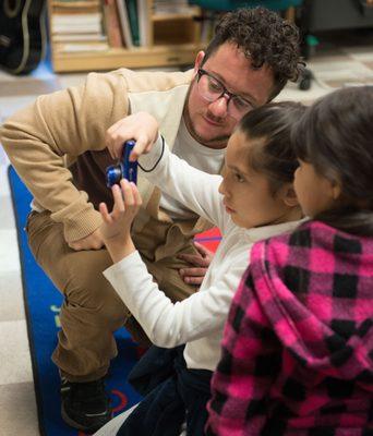 Teaching Artist working one-on-one with students in a photography residency.