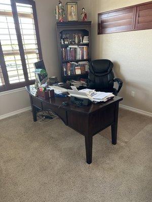 Office desk and book shelf.