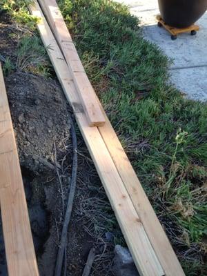 So here's how they like to store their lumber - on top of your landscaping - and not in the empty dirt space you have