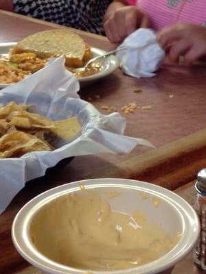 That's a child's plate bubbling and just slid in front of her causing rice to fly out and not the only time it happened.