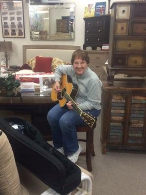 Happy Customer at Michael's Furniture singing & playing the guitar for us today!!