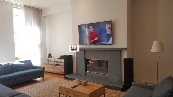 65 inch Sony OLED wallmounted over an active Fireplace
 Soho, NYC