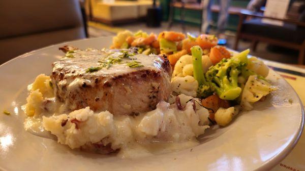 Tomahawk Pork Chop over Mashed Potatoes w/ Steamed Vegetables