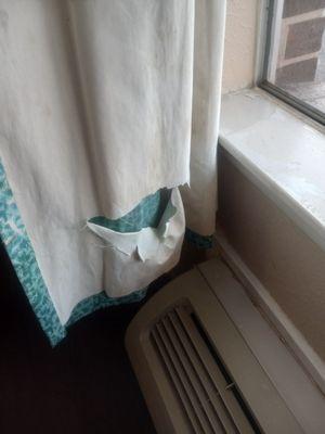 Torn up curtains. The ac doesn't work either.