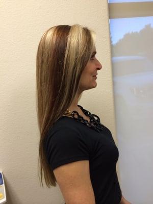 Chunk highlights with brown, auburn and blond. Roots colored with light brown