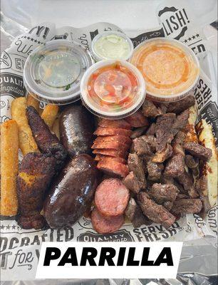 Ribeye steak, sausage, chicken, blood sausage, plantains, fried cheese, fries, rice and beans poco de gallo, chimichurri and mayo.