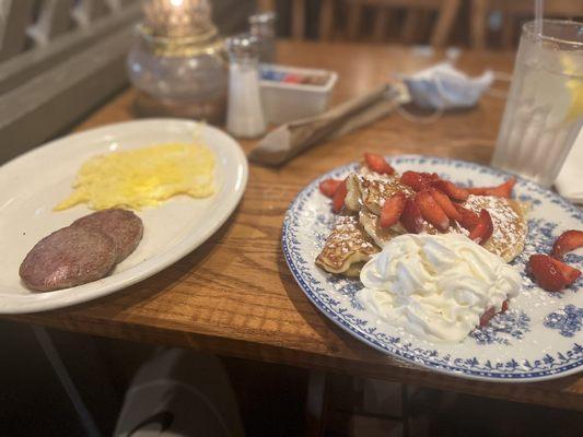 Strawberry cheese stuff pancakes w/whip cream  2 sausage patties and scrambled eggs