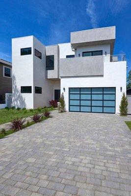 New Construction with smooth stucco, and energy efficient windows.