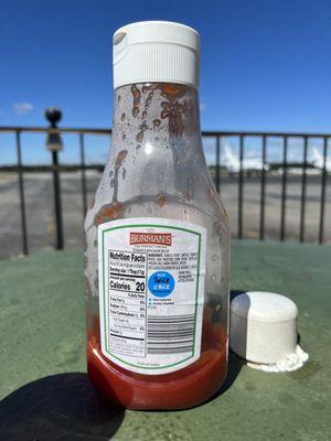 Don't eat this ketchup. It's been sitting out in the sun and I'm the back says "refrigerate after opening"