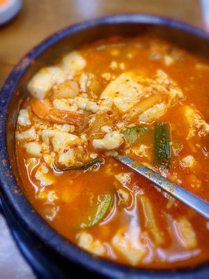 Spicy tofu soup with seafood.