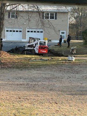 section of driveway that had a depression with asphalt begin removed.