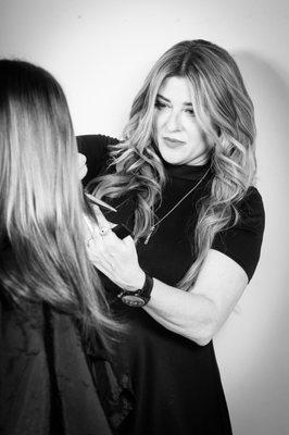 Deana cutting extensions for a new client.